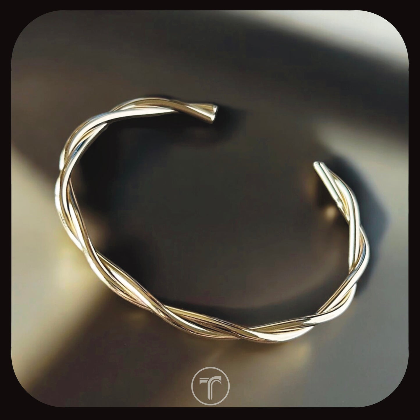 The Twisted Oval Bangle